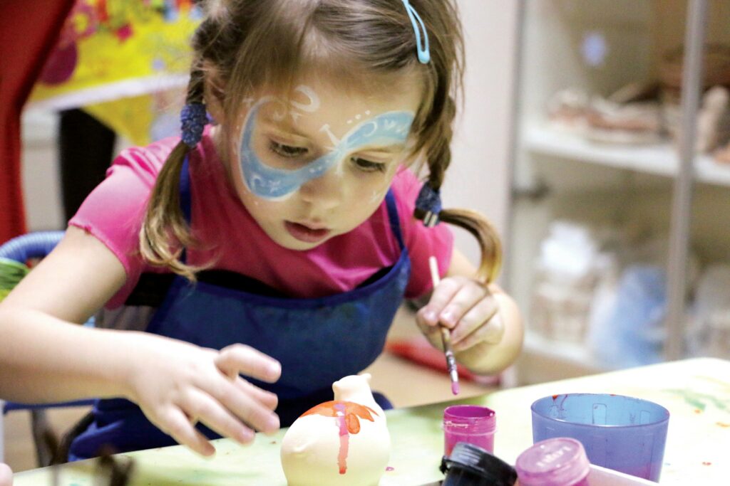 child pottery painting